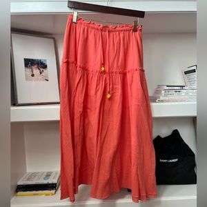 Coral maxi skirt with smiley face tassels